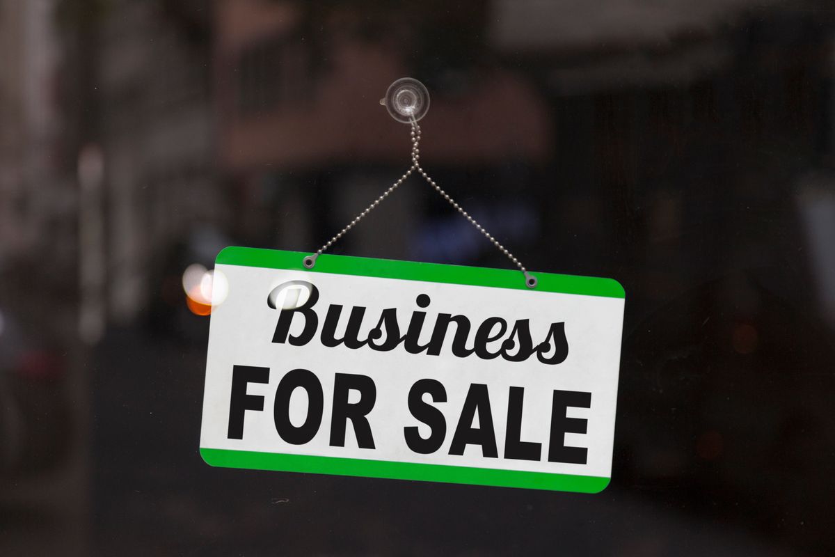 Business for sale sign in a window