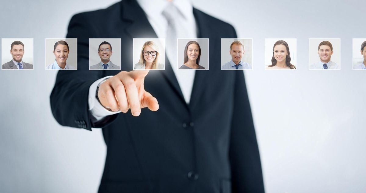 Businessman choosing candidates to recruit