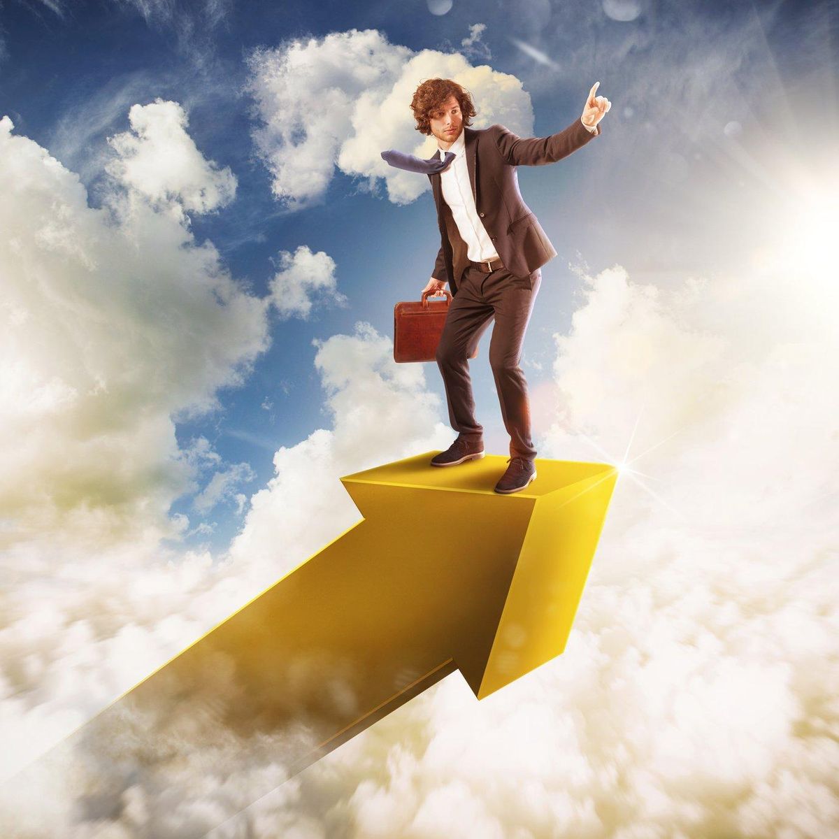 Businessman on an arrow in the sky