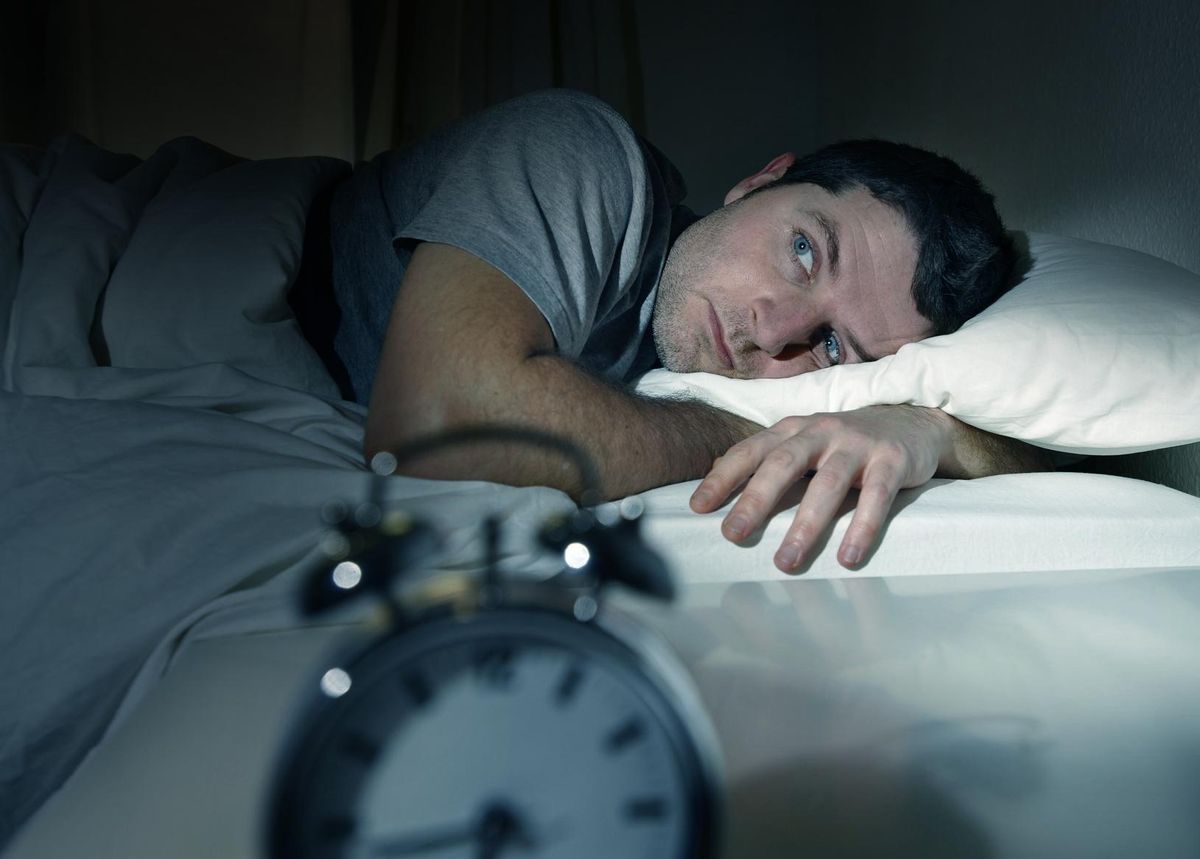 businessman suffering from insomnia
