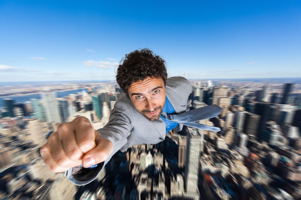 Businessman superhero flying above a city