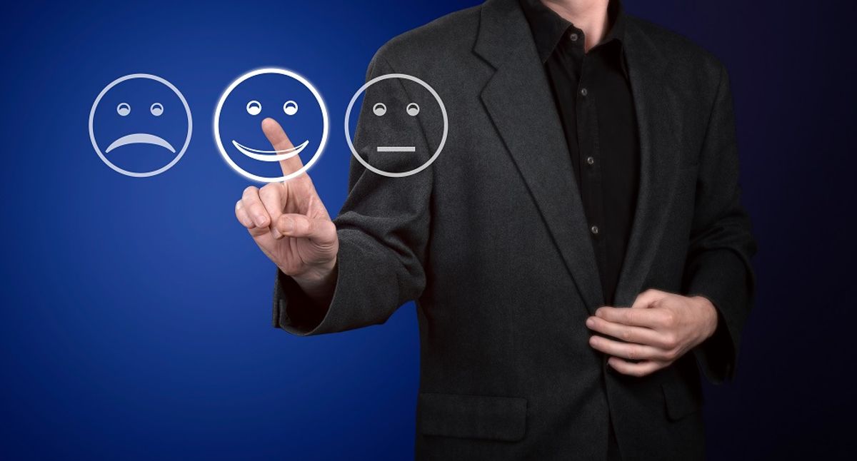 Businessman touching screen of customer service evaluation form.