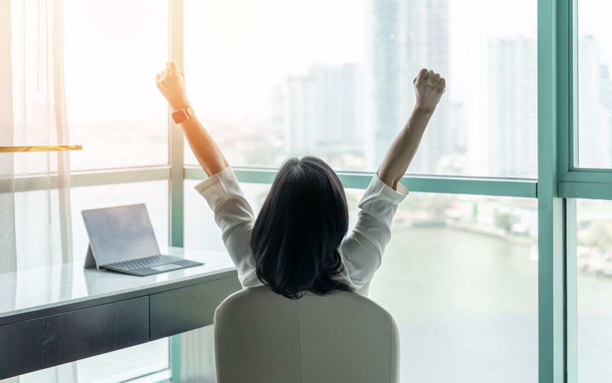 Businesswoman celebrating wins driven by business analysis techniques