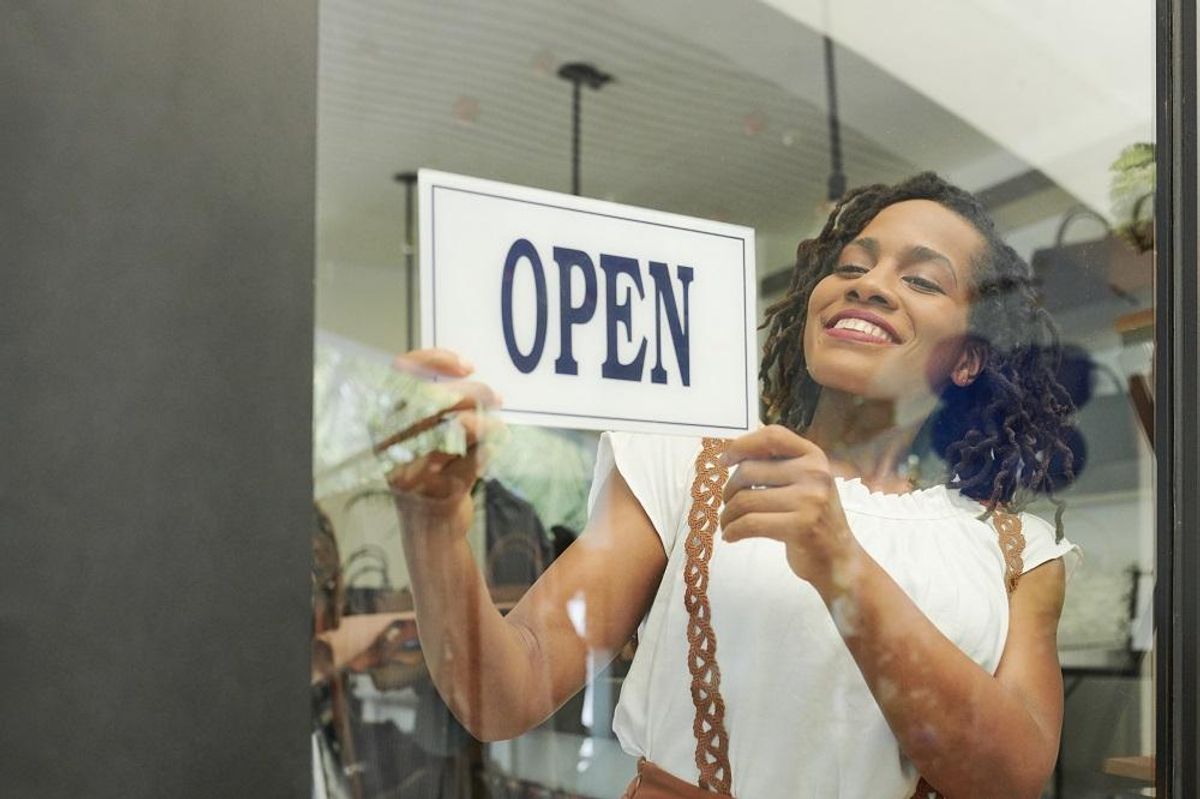 Cheerful woman restarting closed business