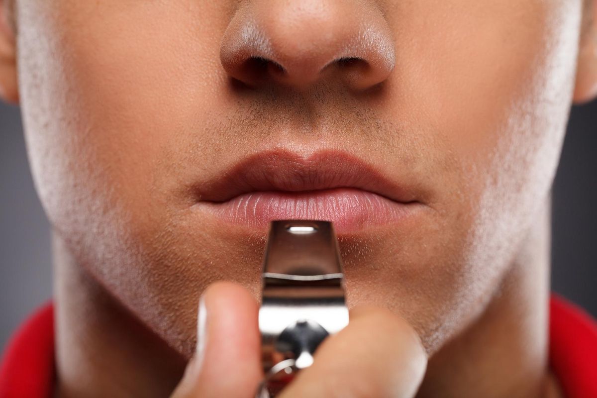 close-up of coach with whistle