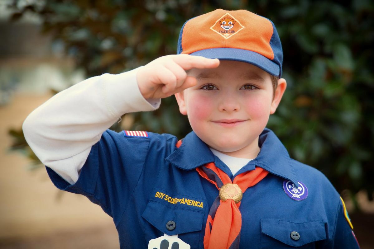 Cub Scout gives salute