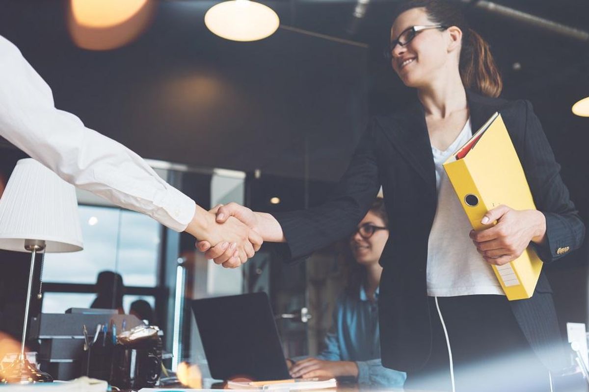 Shaking hands on an acquisition agreement