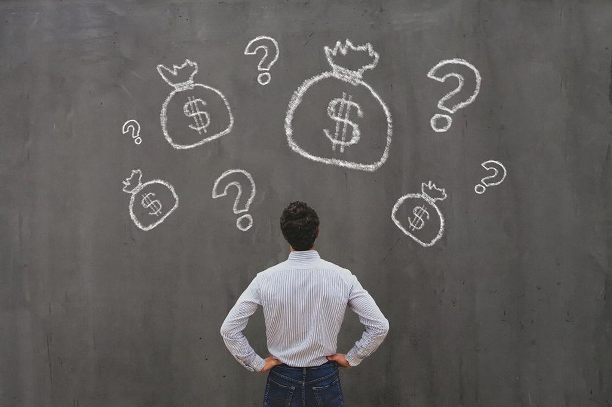 Small business owner considering ways to raise capital