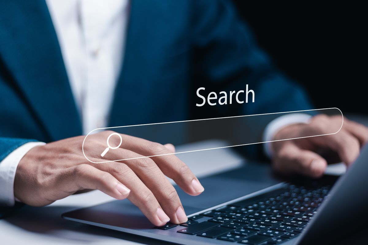 Small business owner doing online research to find potential customers