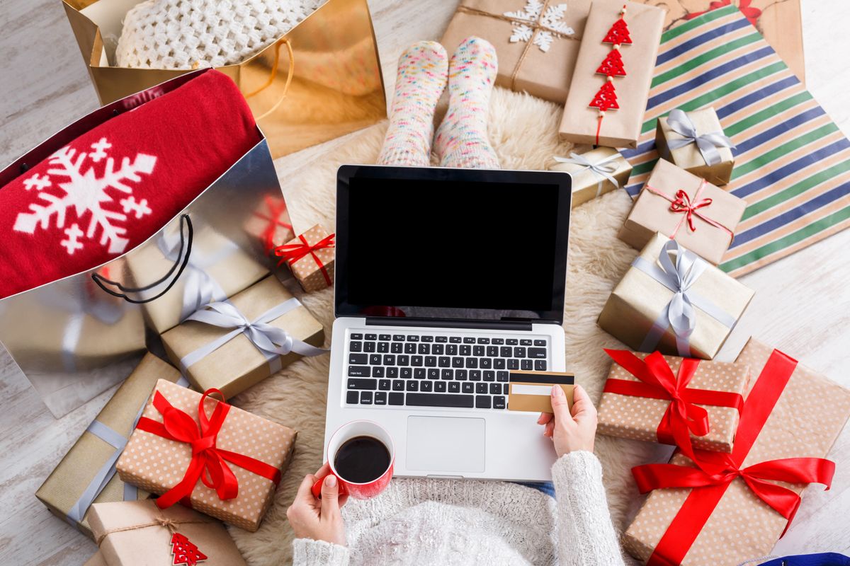 Woman doing holiday shopping online in 2024