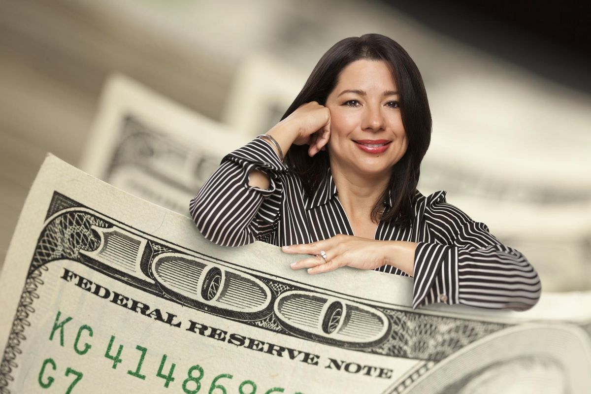 woman leaning on hundred dollar bill