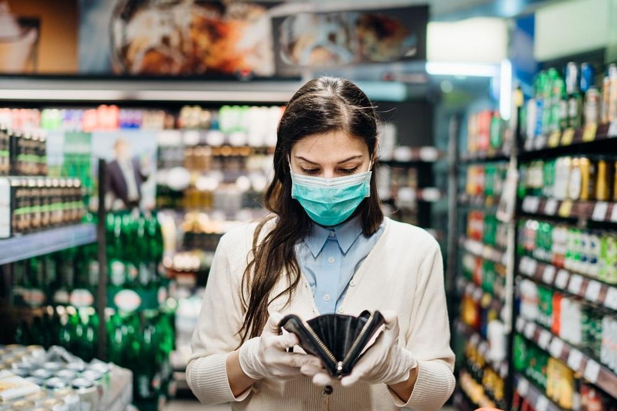 woman with mask groceries shopping