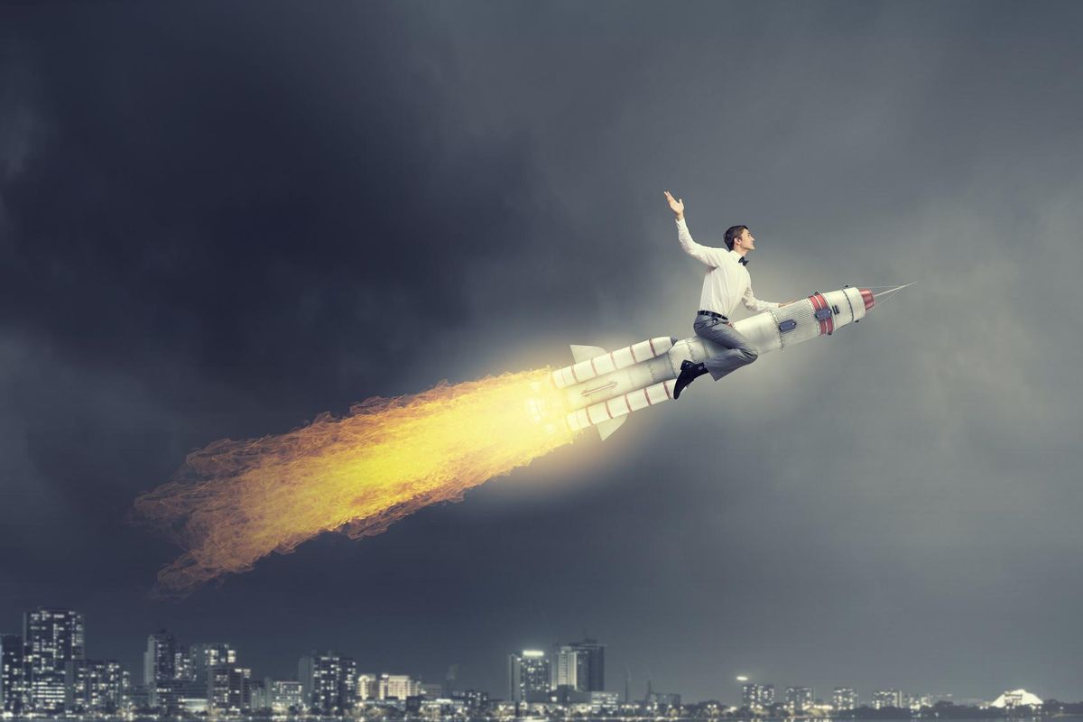 Young businessman flying in sky on space rocket