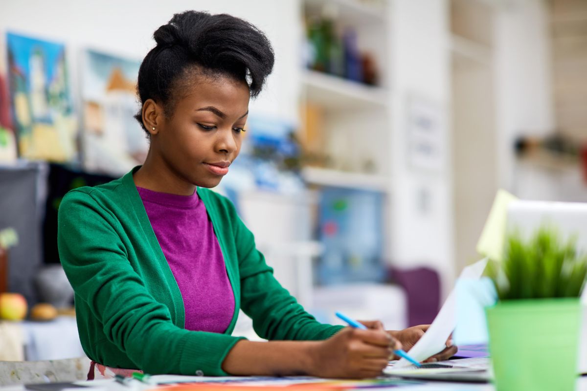Young college student working on her business